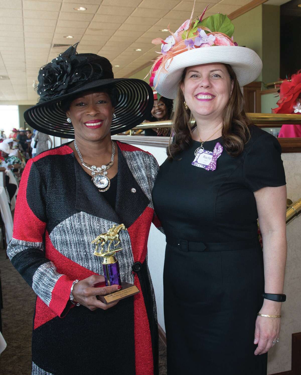 Mary Trice’s (left) ensemble showcased SIUE pride with red and black accents, and earned the best hat award. She stands with Vice Chancellor for University Advancement and CEO of the SIUE Foundation Rachel Stack.