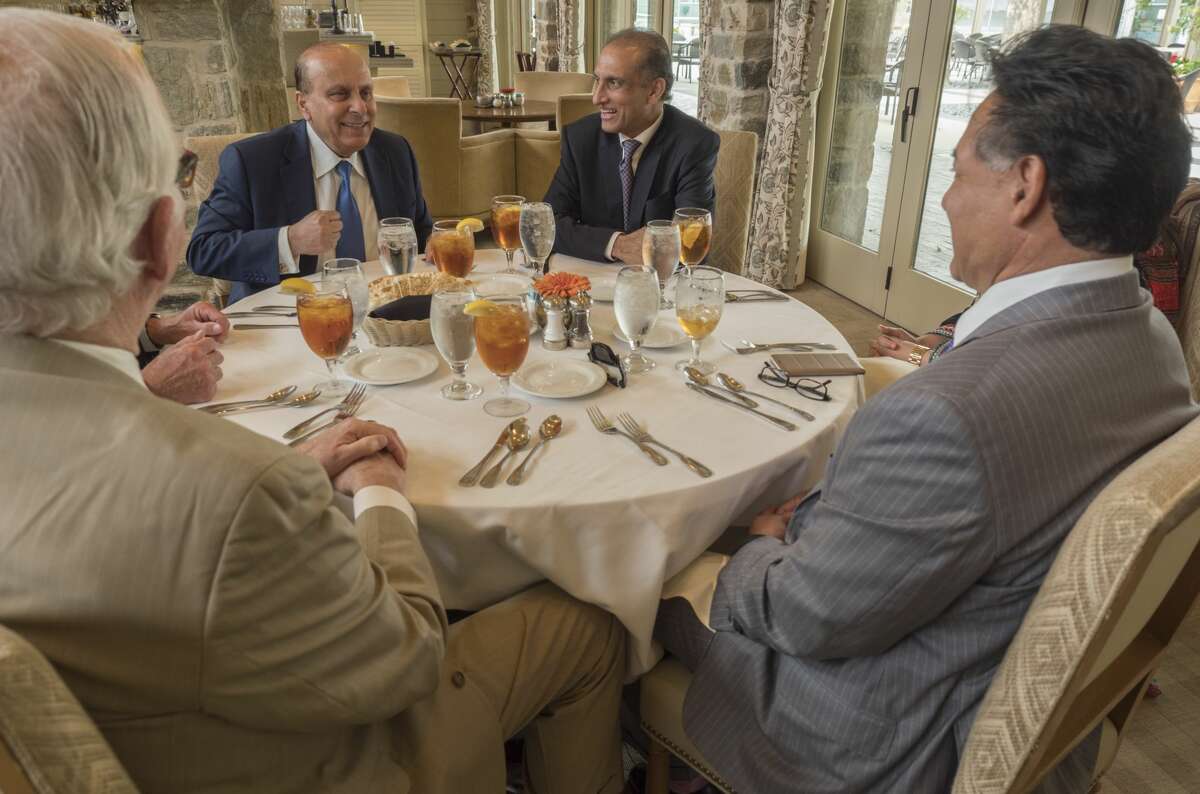 Aizaz Ahmad Chaudhry Ambassador of the Islamic Republic of Pakistan to the United States, center, meets with Midlander Javid Anwar, left center, Midland County Judge Mike Bradford, left , Jose Cuevas and others 5/23/17 at a liuncheon at The Racquet Club in Midland. Tim Fischer/Reporter-Telegram