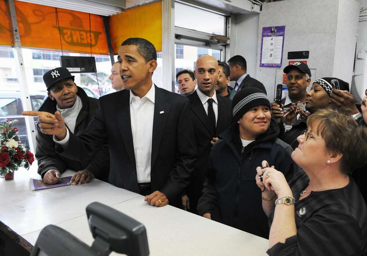 FILE - US president-elect Barack Obama orders his lunch at Ben's Chili Bowl restaurant January 10, 2009 in Washington, DC. Obama ordered a chili half smoke at the Washington landmark during a lunch with DC mayor Adrian Fenty.