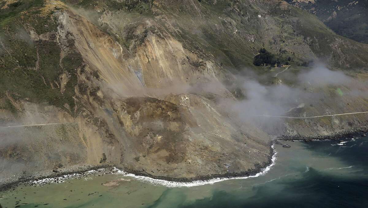 In this aerial photo taken Monday, May 22, 2017 provided by John Madonna showing a massive landslide along California's coastal Highway 1 that has buried the road under a 40-foot layer of rock and dirt. A swath of the hillside gave way in an area called Mud Creek on Saturday, May 20, covering about one-third of a mile, half a kilometer, of road and changing the Big Sur coastline. (John Madonna via AP)