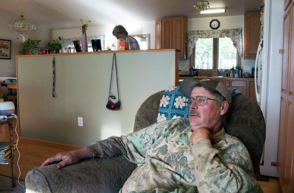 In this Thursday, May 18, 2017 photo, Larry Berg and his wife Carol at their home in White Sulfur Springs, Mont. The couple recently qualified for Montana's Medicaid expansion program. A dip in their income qualified them for the state-federal health insurance program. Last year, they got federal subsidies that allowed them to buy health insurance through the marketplace set up the federal health care law put in place under President Barak Obama. The insurance came in handy when Larry Berg was diagnosed and treated for a rare medical condition affecting blood flow in his neck. (AP Photo/Bobby Caina Calvan)