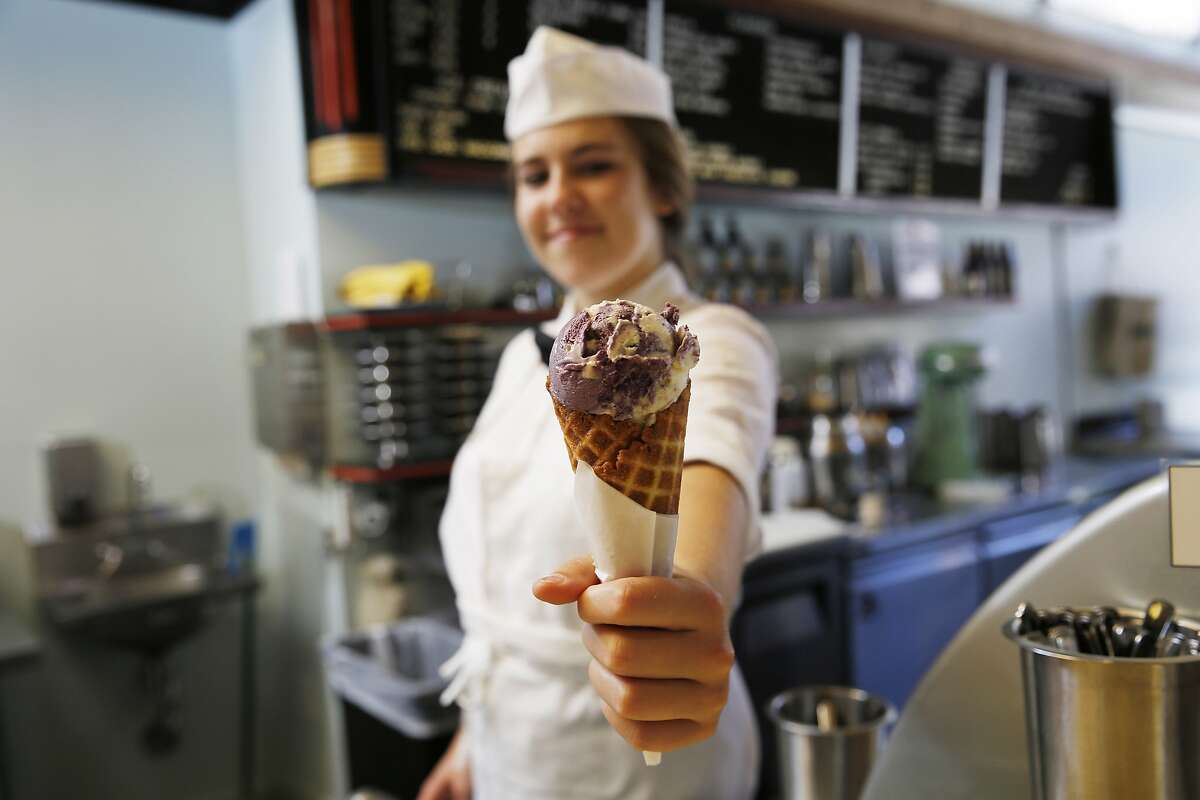 Sarah Huber shows off one of several flavors of ice cream at Ice Cream Bar in San Francisco. If you're looking at treating yourself on National Ice Cream Day, here are the places to head to in the Bay Area and the best scoops you can have.