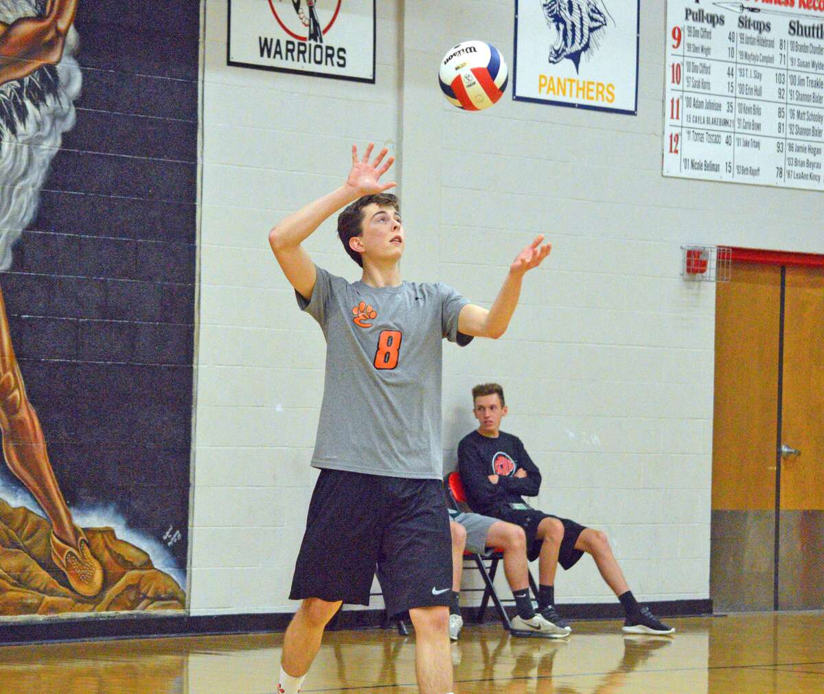 Edwardsville senior Curt Sellers serves the ball during the second game of Tuesday’s match against Granite City in the semifinals of the Granite City Regional.