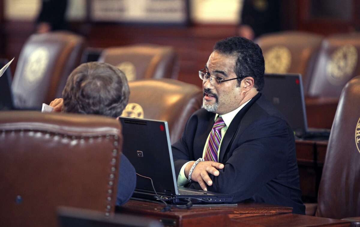 State Rep. Garnet Coleman, D-Houston, talks from his desk on the floor of the Texas House of Representatives in this file photo. Coleman said he would kill his bill rather than allow Senate amendments to it that would impose restrictions on bathroom use and would impose reduced automatic rollback levels for property taxes.
