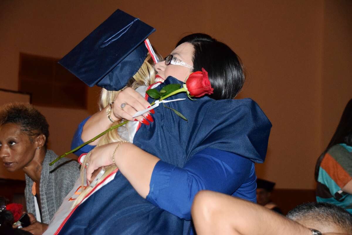 Ash High School graduating senior Avery Patel presents a rose to her mother Tina Rodriguez during the Ash Completion Ceremony on Tuesday evening.