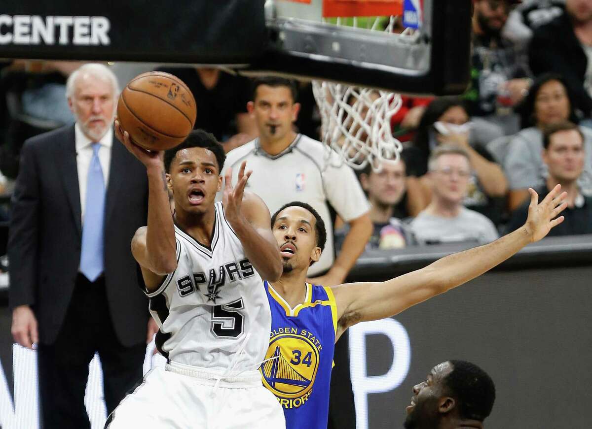 Dejounte Murray of the Spurs shoots against Shaun Livingston of the Golden State Warriors in the first half during Game 4 of the Western Conference finals at AT&T Center on May 22, 2017 in San Antonio.