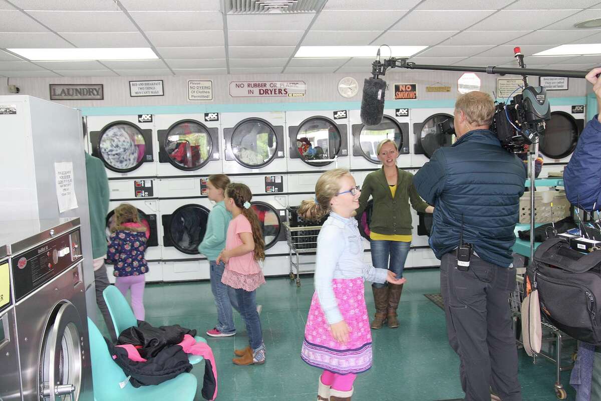 Members of the Putman family from Sand Point visit Bay Wash Coin Laundry Wednesday in Caseville.