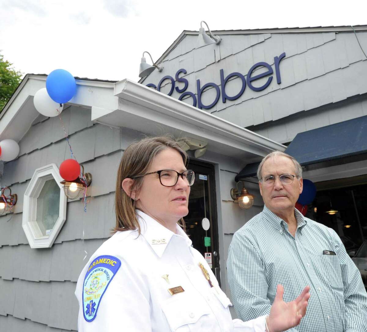 At left, Tracy Schietinger, executive director of GEMS speaks as GEMS Chairman John Raben listens during the GEMS fundraiser at Caren's Cos Cobber Restaurant in the Cos Cob section of Greenwich, Conn., Wednesday, May 24, 2017. Caren Vizzo, the owner of the restaurant said 50% of the proceeds for the day go to GEMS from all the restaurant's sales. The Greenwich Emergency Medical Service, more commonly known as GEMS, is the sole provider of emergency services in the Town of Greenwich and is a non-profit organization.
