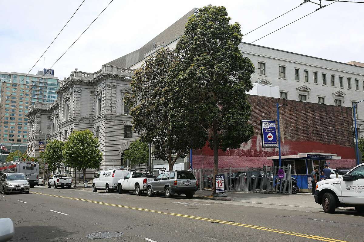 The red building is 1068 Mission St. seen next to the courthouse and before 1064 Mission Street, a leased space used as a parking lot, on Wednesday, May 24 , 2017, in San Francisco, Calif.