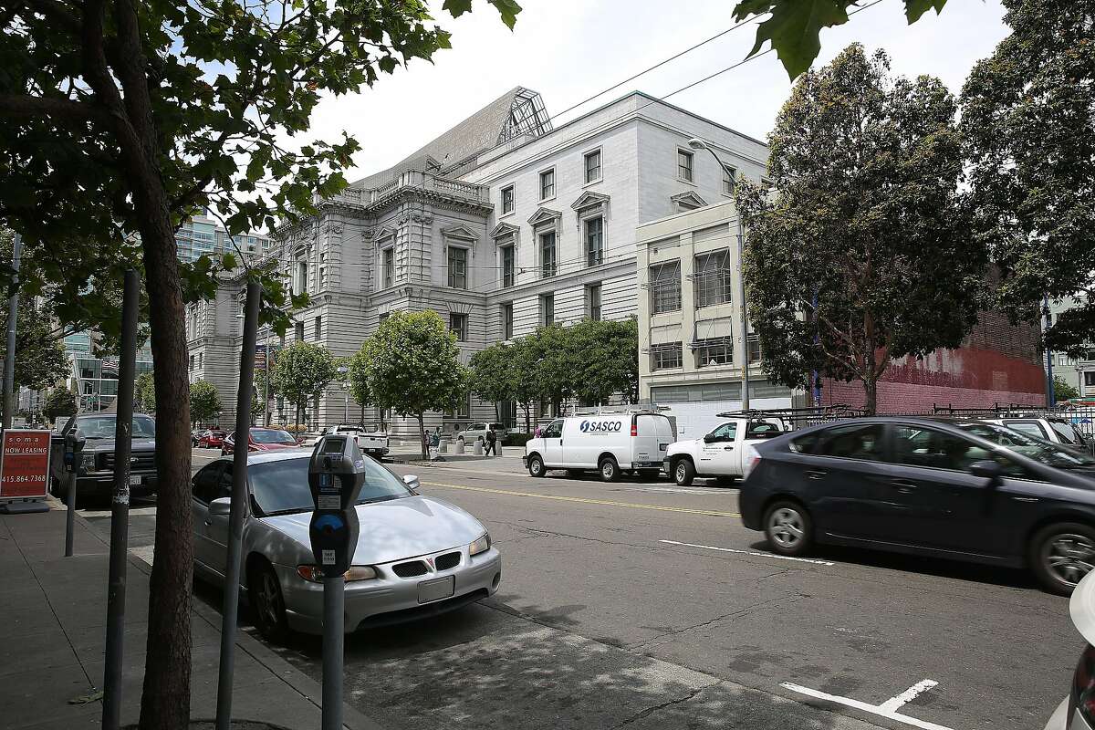 The building at right with neutral facade and red brick alongside is 1068 Mission St. seen right of the courthouse on Wednesday, May 24 , 2017, in San Francisco, Calif.