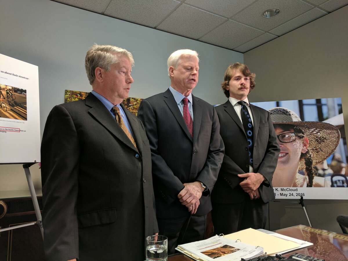 Jeffery Campiche, Phil Arnold and Cody McCloud announce a claim against Seattle and Sound Transit Wednesday for the May 2016 death of Cody's sister, Desiree McCloud. The 27-year-old woman died after her bicycle was caught in First Hill Streetcar tracks, launching her over her handlebars and causing fatal head injuries.