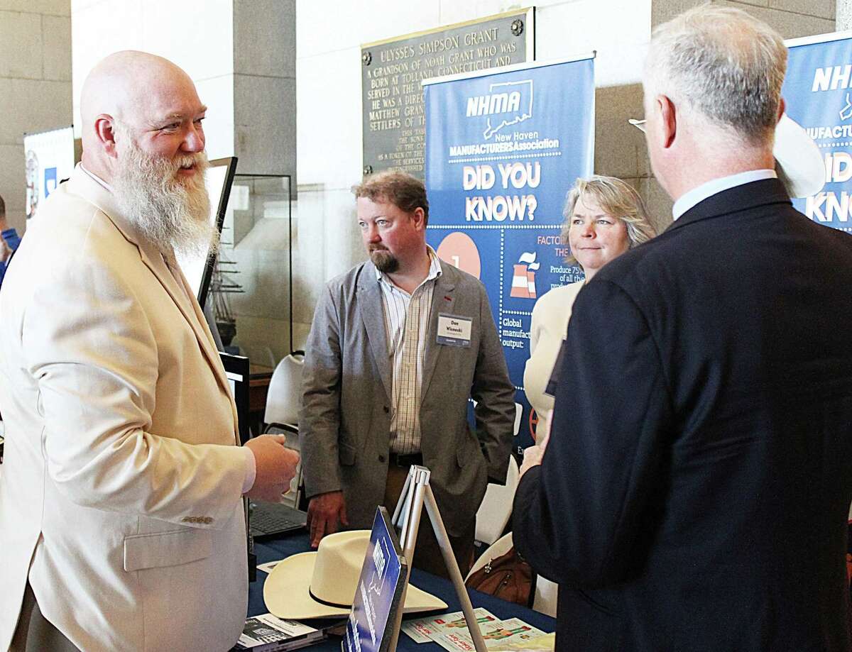 Right, state Representative Bill Buckbee (R-New Milford) spoke with members of the New Haven Manufacturers Association as part of Connecticut Business Industry Associations Manufacturing Innovation Day 2017. More than 30 booths were set up in the North Lobby of the Capitol, all with relevant information on how vital the manufacturing industry is to the state’s economy. Buckbee said the state economy has created a situation in which many local manufacturers are struggling to prosper based on stifling regulation and off-shore competition. At a legislative level, Buckbee said, the state can offer more incentives for locally manufactured products to be used in state projects relating to aerospace, defense and infrastructure.