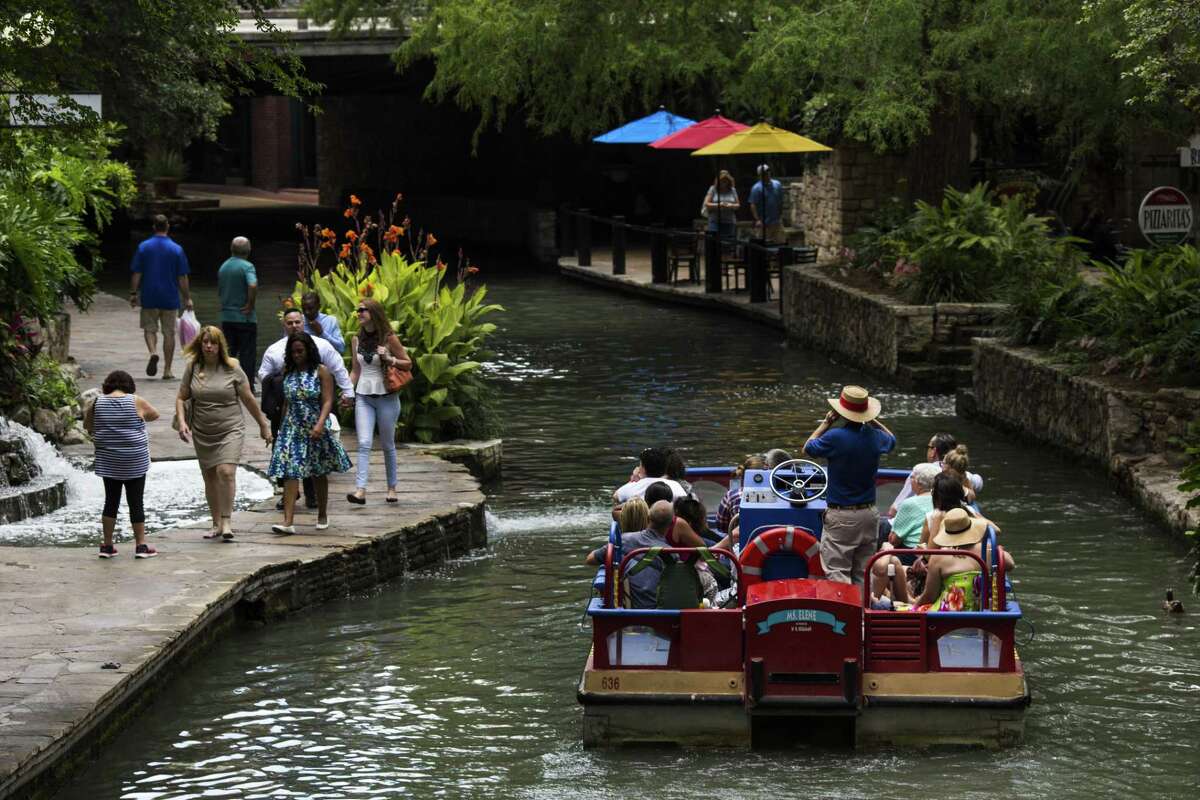 A boat tour guide with Rio San Antonio Cruises drives his group down the San Antonio River in downtown San Antonio on June 10, 2016. The City Council is expected to select a new company to operate the barges Thursday.