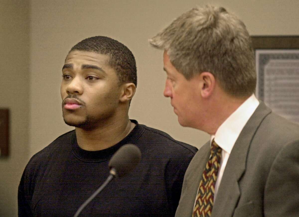 Michael Bennett, former Wisconsin running back, appears for a bail hearing with his attorny Stephen P. Hurley, right, Monday, Feb. 12, 2001, in a Dane County Court on felony charges for intimidating a victim. (AP Photo/Andy Manis). HOUCHRON CAPTION (04/08/2001): Bennett. HOUSTON CHRONICLE SERIES: NFL DRAFT 2001.