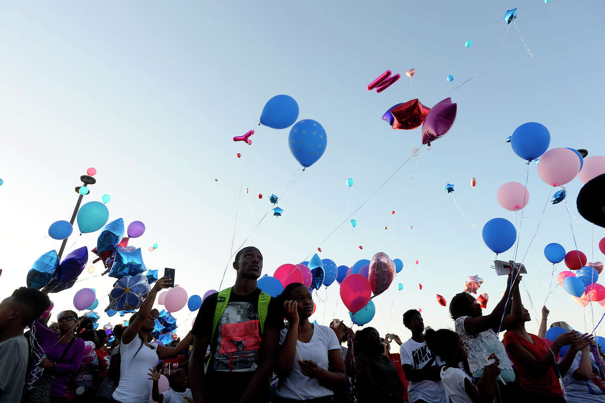 Attendees release pink and blue balloons during a vigil at West Brook High School Wednesday evening for Jordan Brown, 16, and sister Jadyn Brown, 10, who were killed in a car wreck last Friday. Photo taken Wednesday 5/24/17 Ryan Pelham/The Enterprise