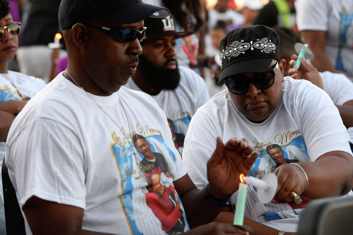 Family members light their candles during a vigil at West Brook High School Wednesday evening for Jordan Brown, 16, and sister Jadyn Brown, 10, who were killed in a car wreck last Friday. Photo taken Wednesday 5/24/17 Ryan Pelham/The Enterprise