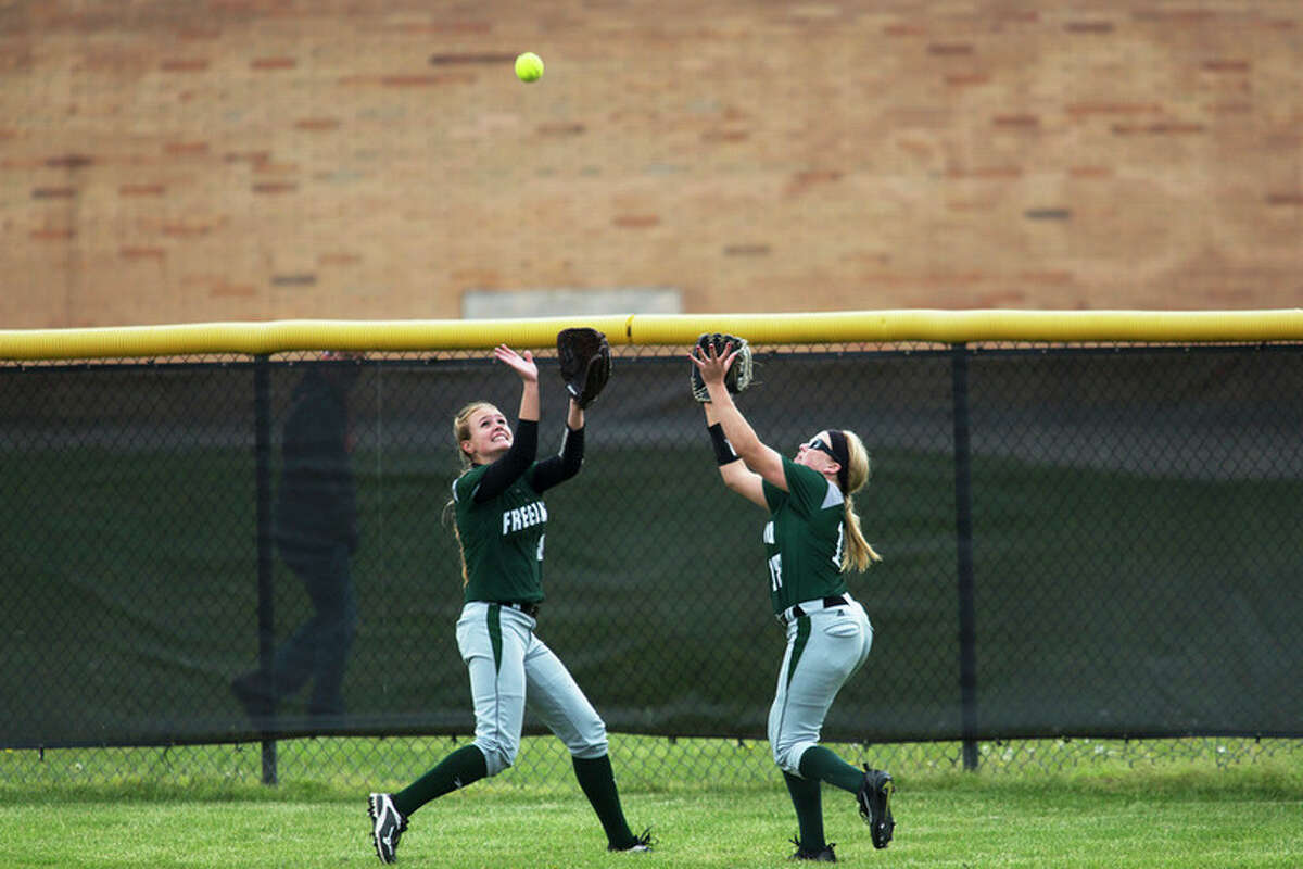THEOPHIL SYSLO | For the Daily News Freeland's Kara Szabo and Chloe Savage collide while attempting to catch a fly ball in a game against Bullock Creek at Bullock Creek High School on Wednesday.