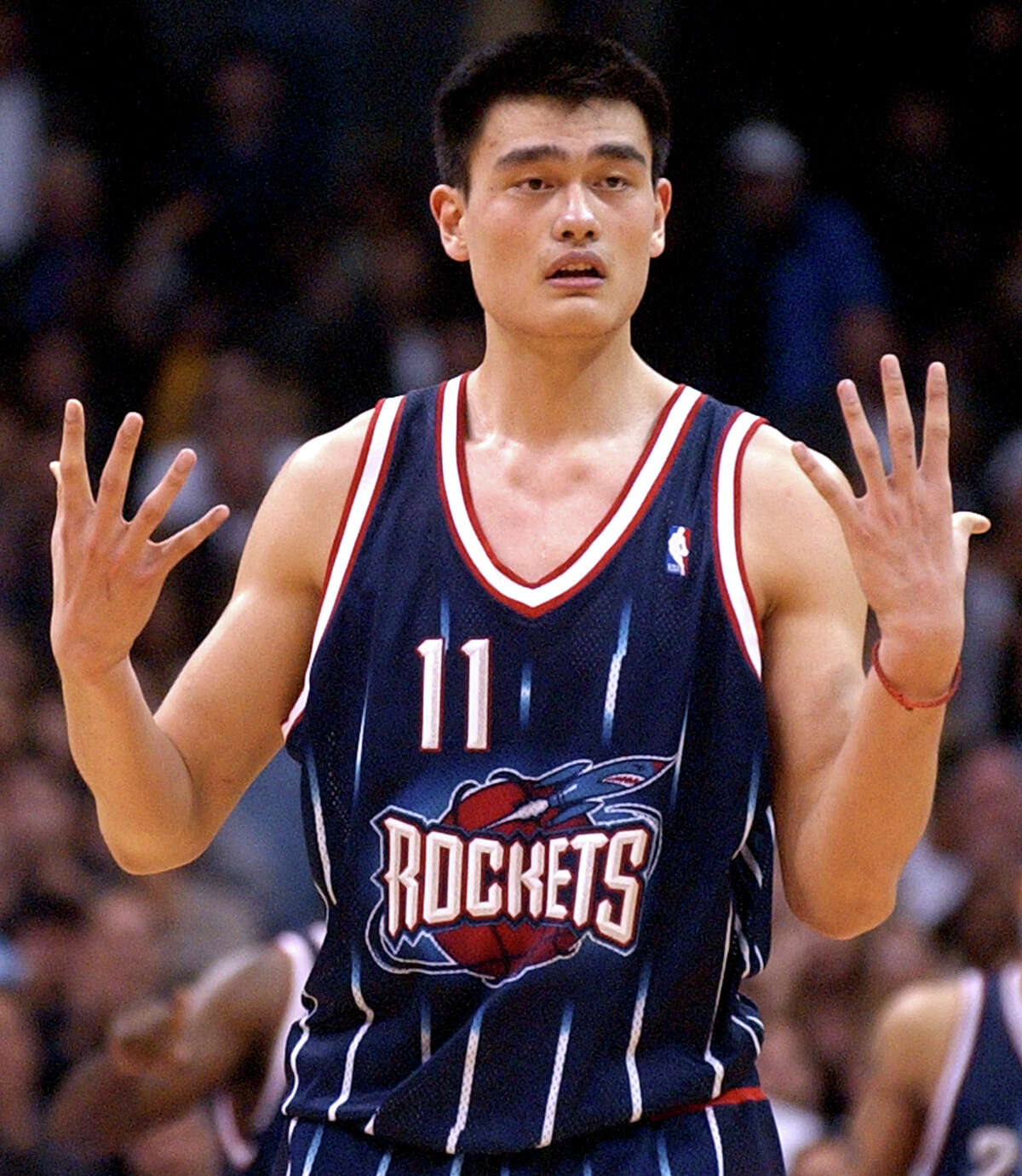 Houston Rockets' Yao Ming protests to a referee after fouling out during the first overtime of the Rockets' 106-99 double overtime loss to the Los Angeles Lakers at Staples Center in Los Angeles, Tuesday, Feb. 18, 2003. (AP Photo/Chris Pizzello)