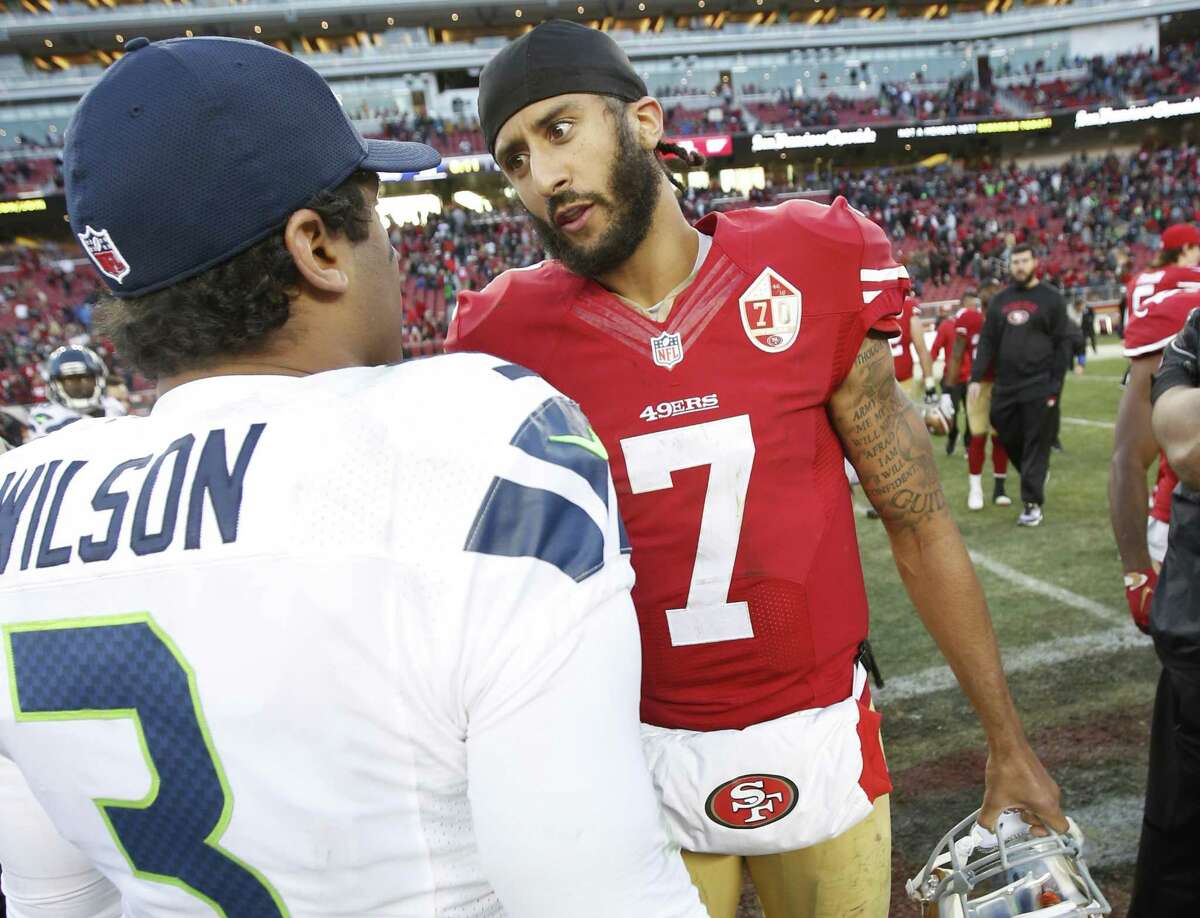 SANTA CLARA, CA - JANUARY 1: Russell Wilson #3 of the Seattle Seahawks and Colin Kaepernick #7 of the San Francisco 49ers talk on the field following the game at Levi Stadium on January 1, 2017 in Santa Clara, California. The Seahawks defeated the 49ers 25-23. (Photo by Michael Zagaris/San Francisco 49ers/Getty Images)