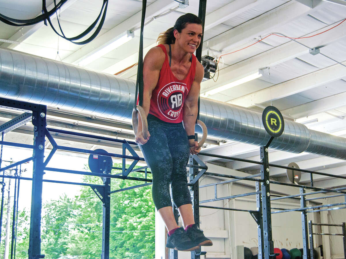 Katie Trombetta works out at Riverbend Crossfit as she prepares to compete in the North Central Super Regionals of the Crossfit Games.