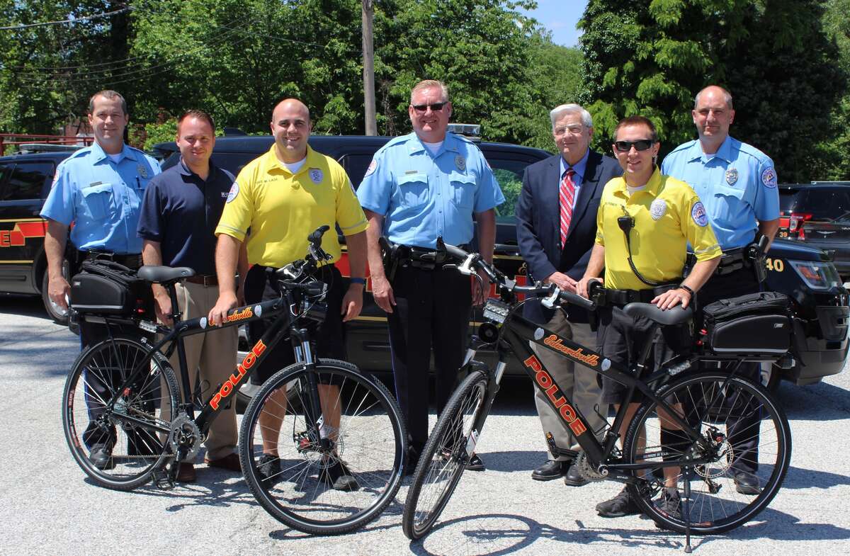 Edwardsville Police officials pose with Madison County Transit after receiving two police patrol bike donations. This is the second donation MCT has made to the bike patrol program thus far.