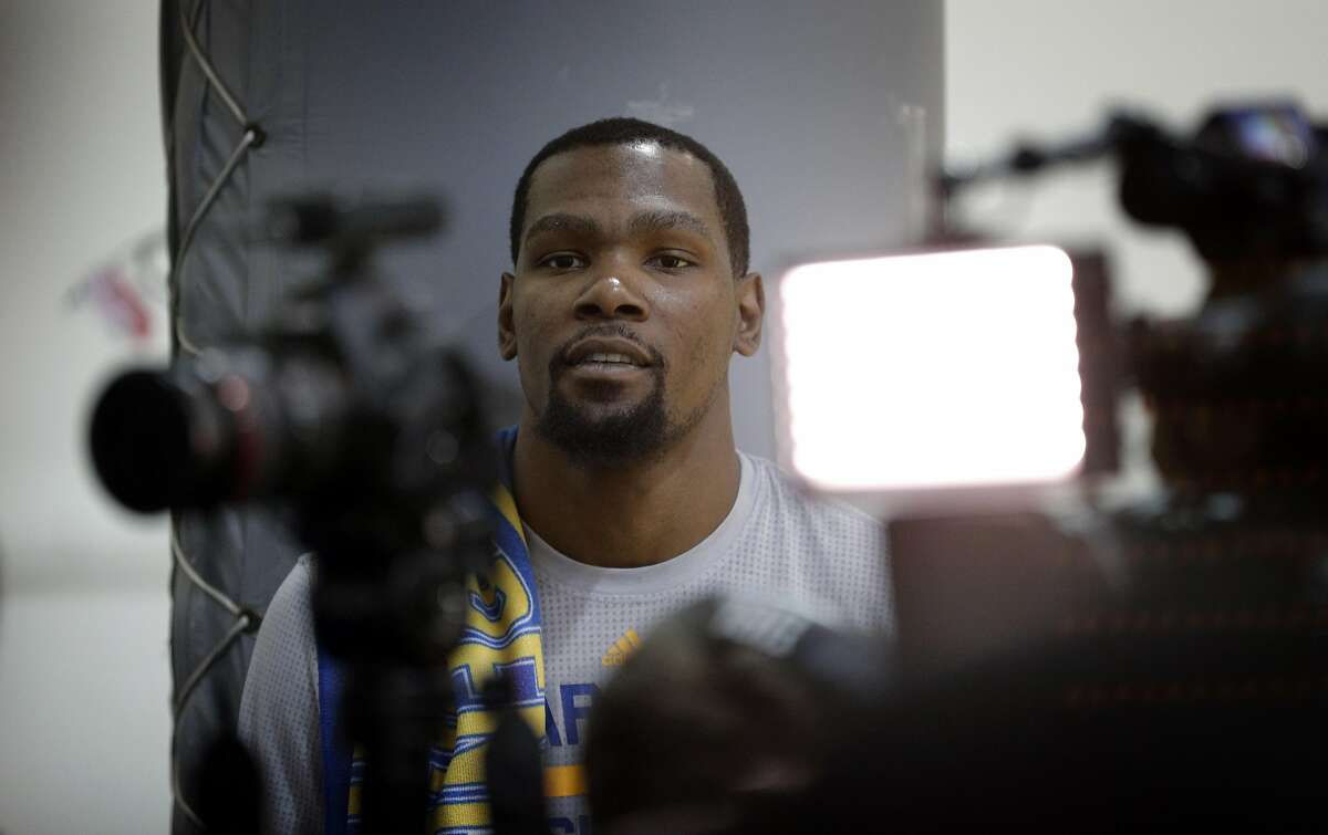 Kevin Durant waits his turn to talk with reporters during practice at the Warriors headquarters in Oakland, Calif., on Thursday, May 25, 2017.