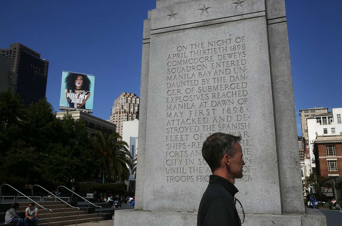 A pedestrian walks past the inscription on the base of the Dewey Monument in Union Square May 23, 2017 in San Francisco, Calif.