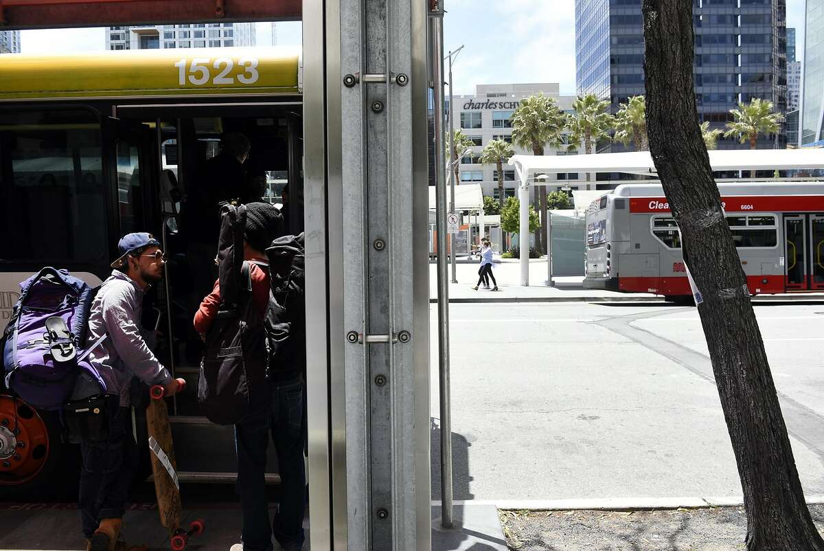 People board a SamTrans bus across from the temporary Transbay Terminal in the Rincon Hill neighborhood of San Francisco, CA, on Thursday May 25, 2017.