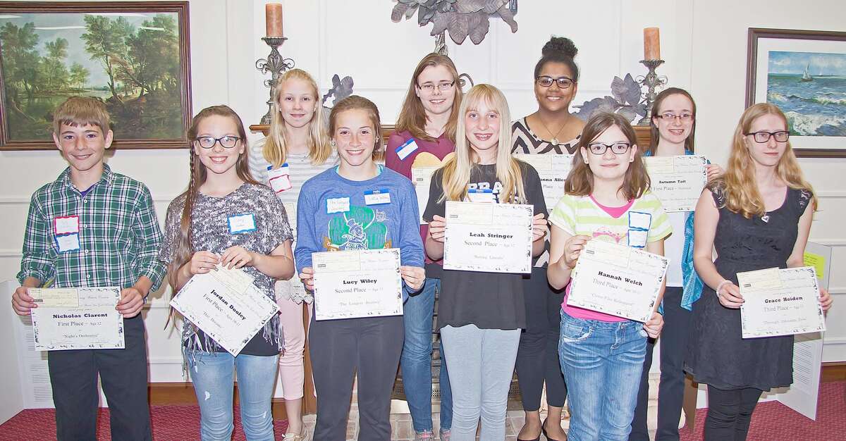   Winners of the Young Writers Creative Writing Contest, sponsored by the Huron Area Writers Group, were presented with checks for their stories, along with certificates. Front row, from left, Nicholas Clarent, Jordan Dooley, Lucy Wiley, Leah Stringer, Hannah Welch and Grace Heiden. Back row, from left, Emma Smalley, Allison Stein, Tianna Allen and Autumn Tait. Missing from the photo are Evalinn Monforton, Emma Van Tol, Olivia Jubar, and Clair Van Tol. (Submitted Photo)