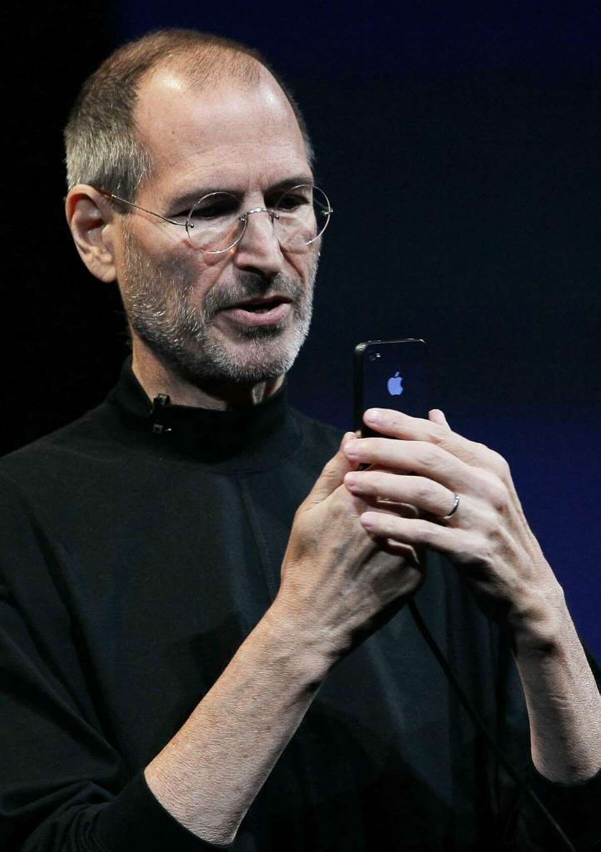 SAN FRANCISCO - JUNE 07: Apple CEO Steve Jobs demonstrates the new iPhone 4 as he delivers the opening keynote address at the 2010 Apple World Wide Developers conference June 7, 2010 in San Francisco, California. Jobs kicked off their annual WWDC with the announcement of the new iPhone 4. (Photo by Justin Sullivan/Getty Images) *** Local Caption *** Steve Jobs