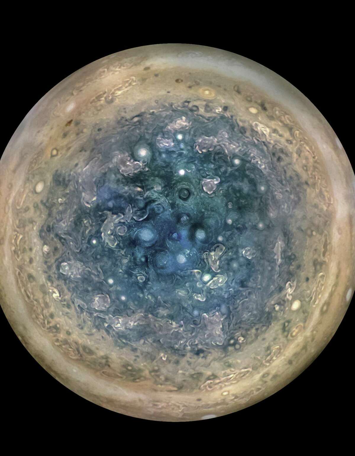 This composite image, made using data from three separate orbits, shows Jupiter’s south pole. The oval features are cyclones, up to 600 miles in diameter. The cyclones are separate from Jupiter’s trademark Great Red Spot, a raging hurricane-like storm south of the equator.