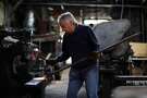 Tony Rosellini works on a pry bar at Edwin Klockar's Blacksmithing Shop in San Francisco, Calif., on Wednesday, May 24, 2017.  The shop is a piece of the last working bit of old Rincon Hill, a blacksmith shop on Folsom Street. It's a city landmark, with dirt floors in the back. But Tony Rosellini, the blacksmith is 87 years old, and its fate is in the air. Travis Kelly, his grandson, is rethinking the place.
