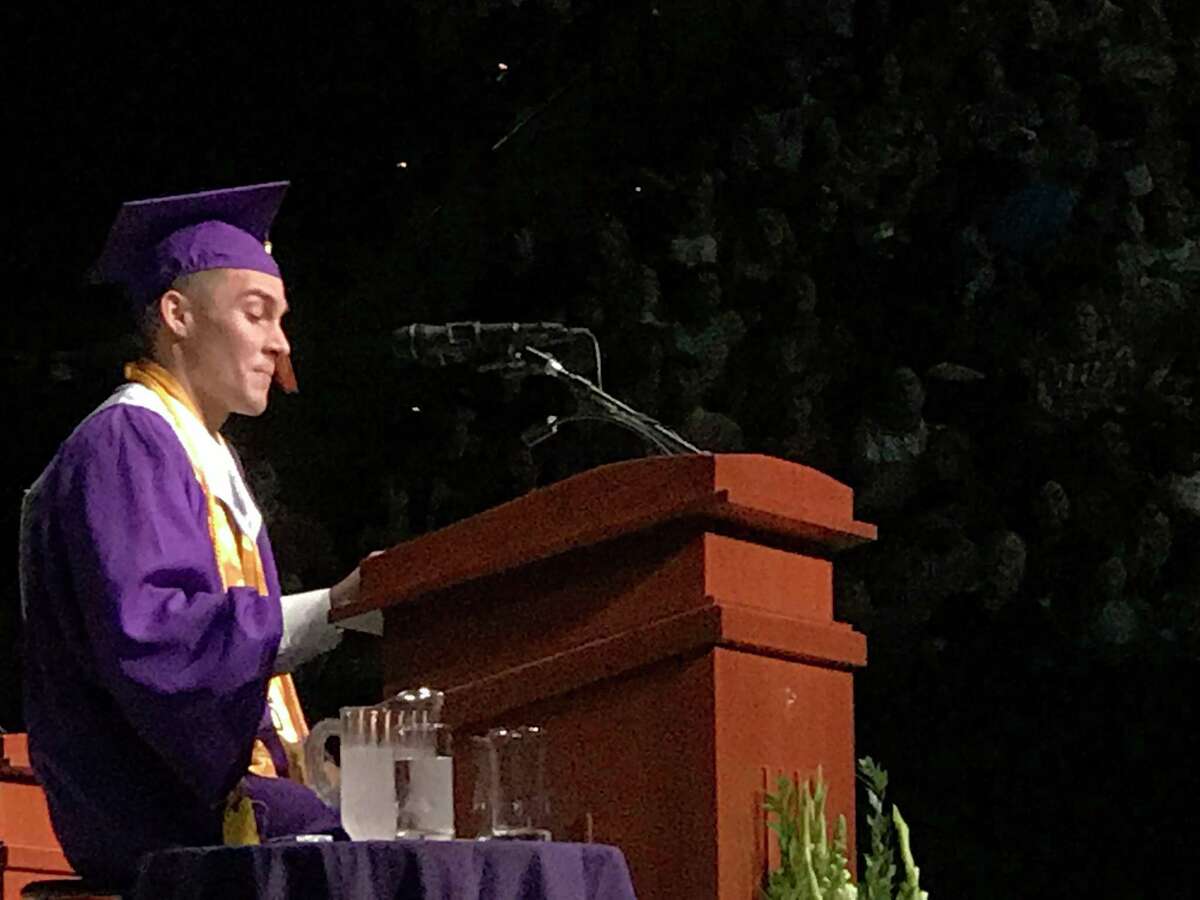 Montgomery High School valedictorian and cross country state-qualifier Tate Paulson speaks at MHS's graduation ceremony Thursday at Reed Arena in College Station.