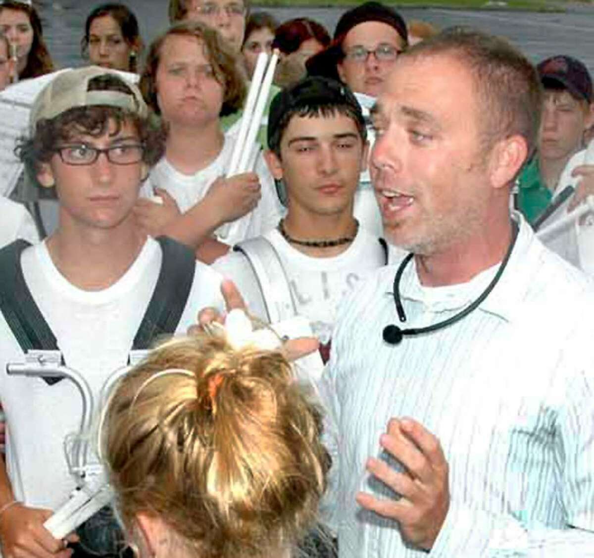 NMHS band director Jonathan Grauer, right, talks to band members in August 2008.