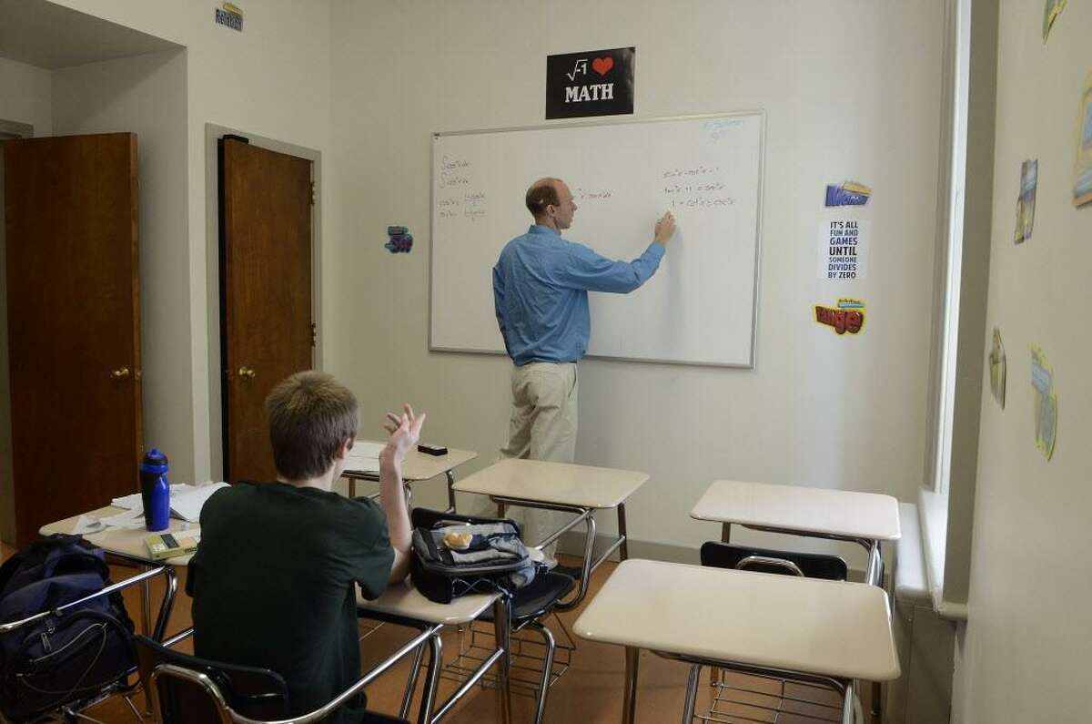FILE — Student Sasha Kucher, 13, Stamford, learns calculus in a class with math teacher Brian Salversen, Ridgefield, at the Beacon School in Stamford, CT on Oct 7, 2015.