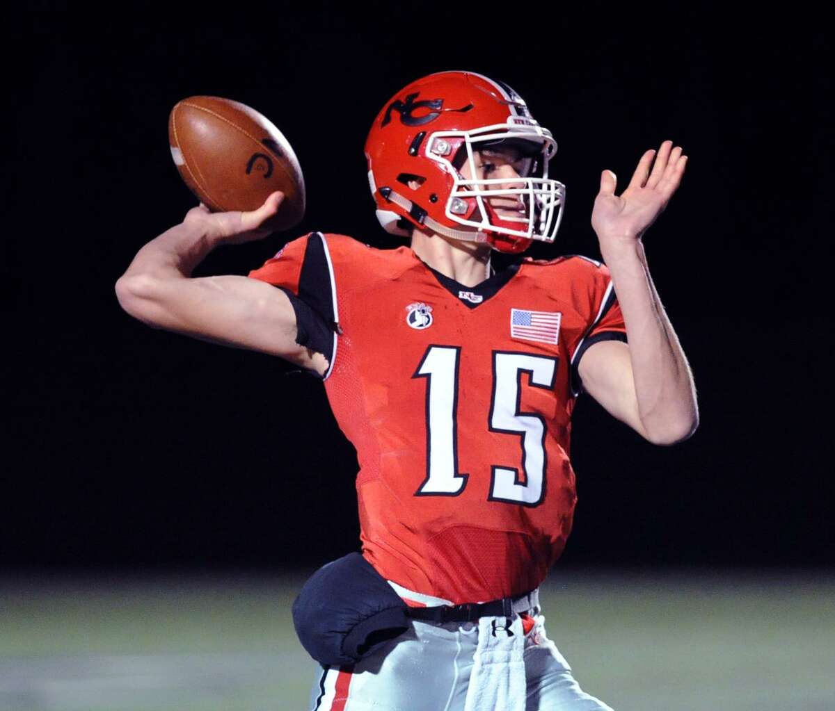 New Canaan quarterback Michael Collins (#15) during the high school football game between New Canaan High School and Fairfield Ludlowe High School at New Canaan, Conn., Friday night, Nov. 13, 2015.