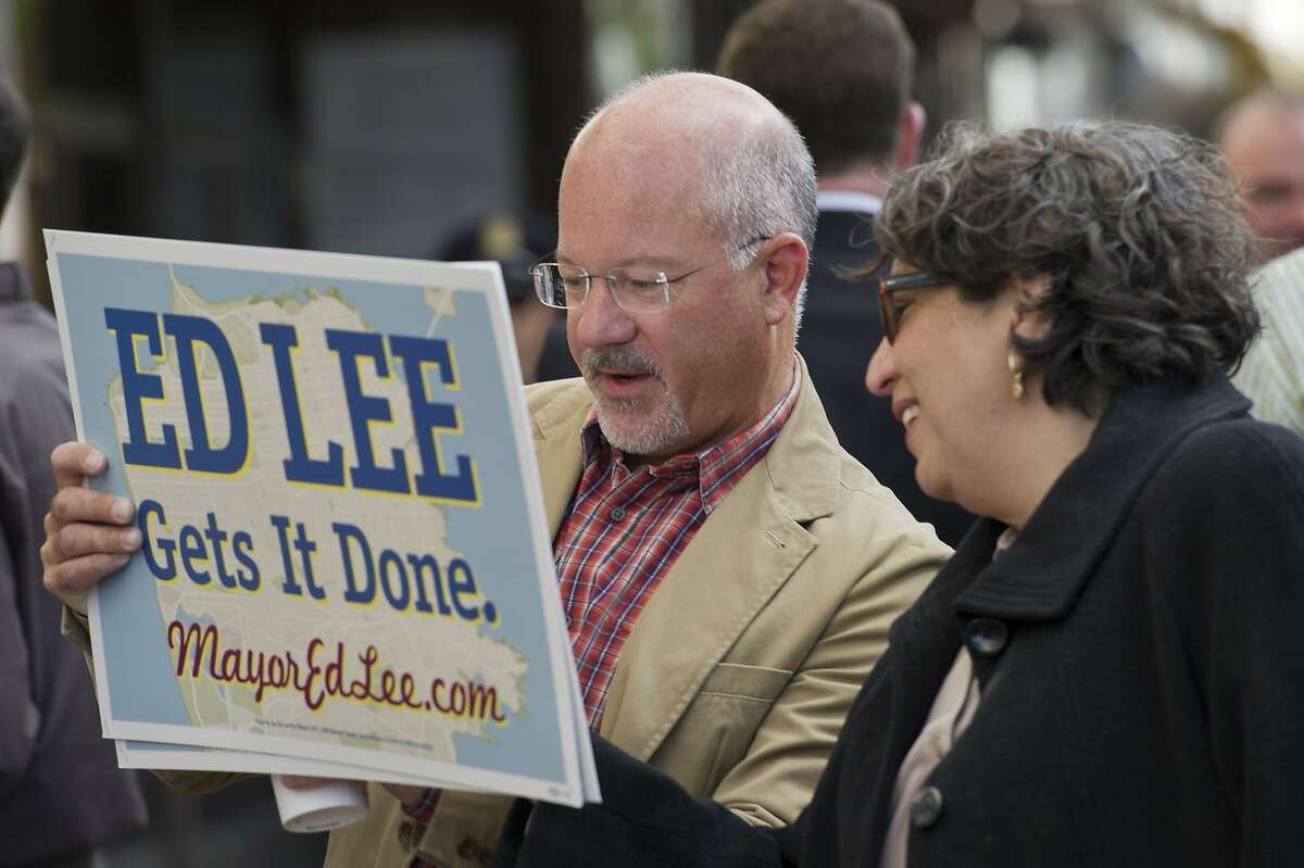 Steve Kawa Ed Lee's chief of staff looks at a sign with Olga Ryerson also a staff member for Ed Lee at the Lee campaign headquarters on Market Street on August 20, 2011 in San Francisco, Calif. Photograph by David Paul Morris/Special to the Chronicle