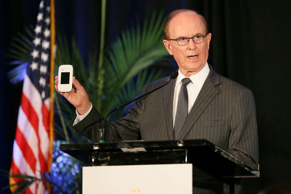 County Judge Nelson Wolff holds a Sprint Pocket Wi-Fi, one of 150 that will be available to be checked out at the Bexar County BiblioTech, while giving his annual "State of the County" address, hosted by the North San Antonio Chamber of Commerce, at the Omni San Antonio Hotel at the Colonnade on Friday, May 26, 2017. MARVIN PFEIFFER/ mpfeiffer@express-news.net