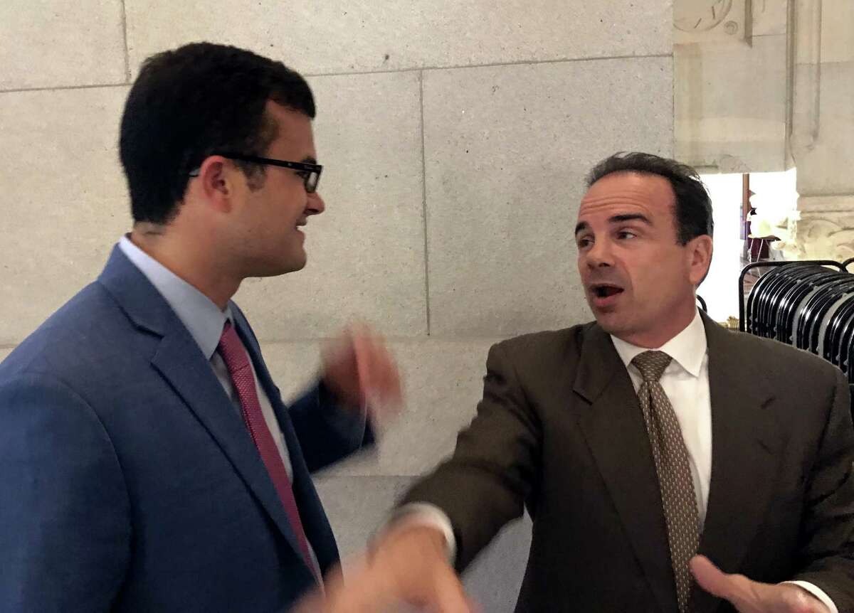 State Sen. Art Linares, R-Westbrook, introduces himself to Bridgeport Mayor Joe Ganim at the Capitol in Hartford, Conn. on Thursday, May 25, 2017. Both have been backers of the Tesla bill, which would allow direct sales of the electric vehicles in Connecticut.
