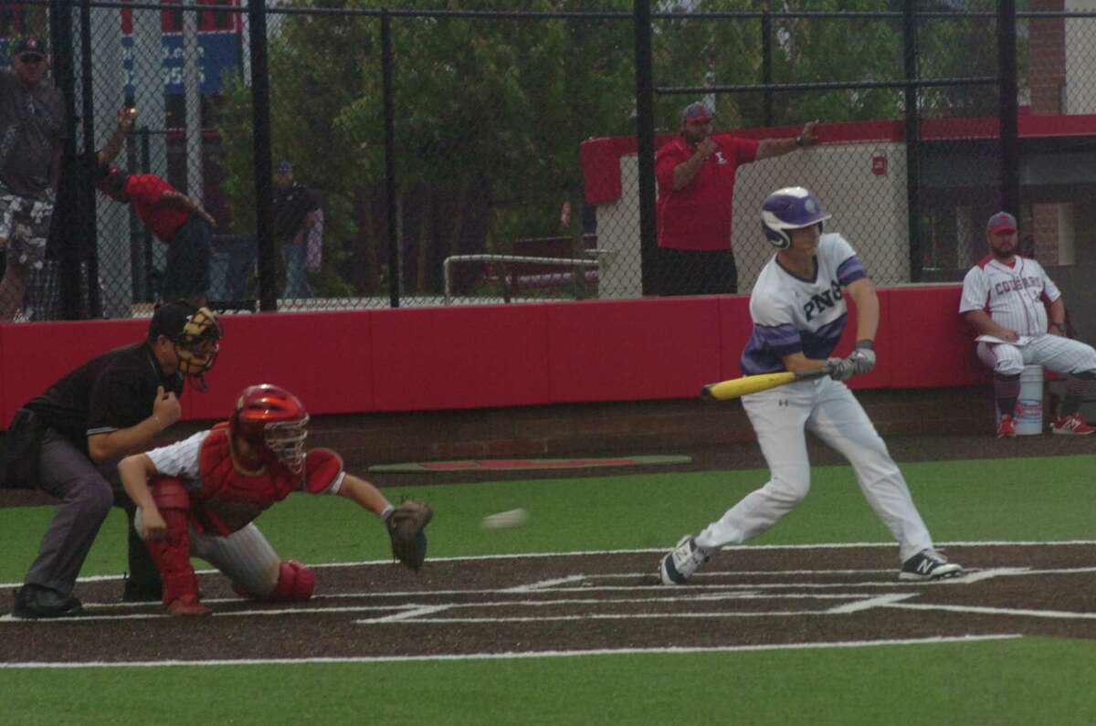PN-G's Brandon Morse checks his swing in the first inning of the Indians' Class 5A regional semifinal game against Tomball on Friday at Crosby High School.