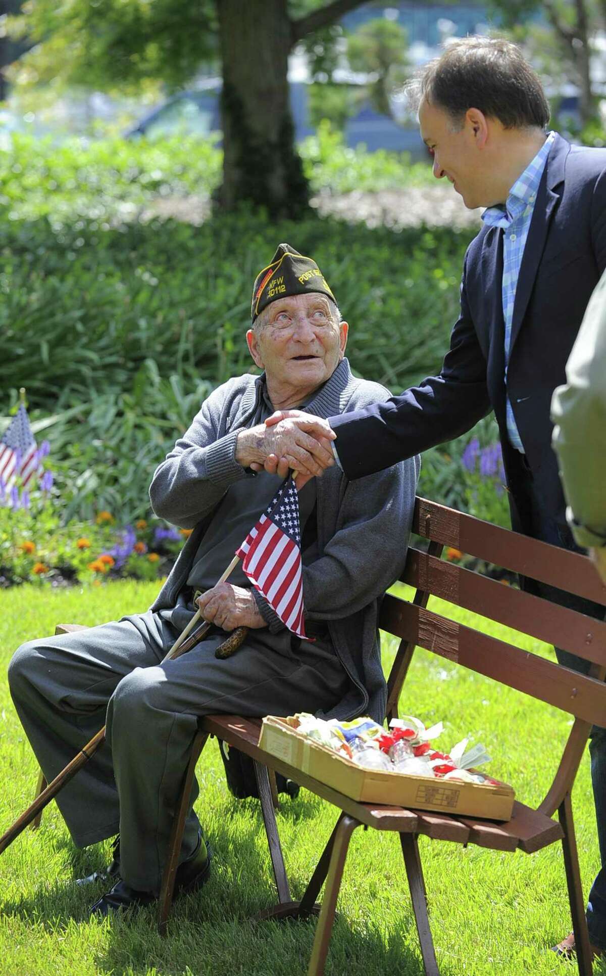 Fred Intrieri, 92, of Greenwich is greeted by Greenwich First Selectmen Peter Tesei prior to the Cos Cob VFW Post 10112 Memorial Day Ceremony to honor those who died for our country while serving in the United States Armed Services at the Cos Cob Dock VFW memorial in Greenwich, Conn. on Saturday, May 27, 2017. Intreri served in the Army during WWII.