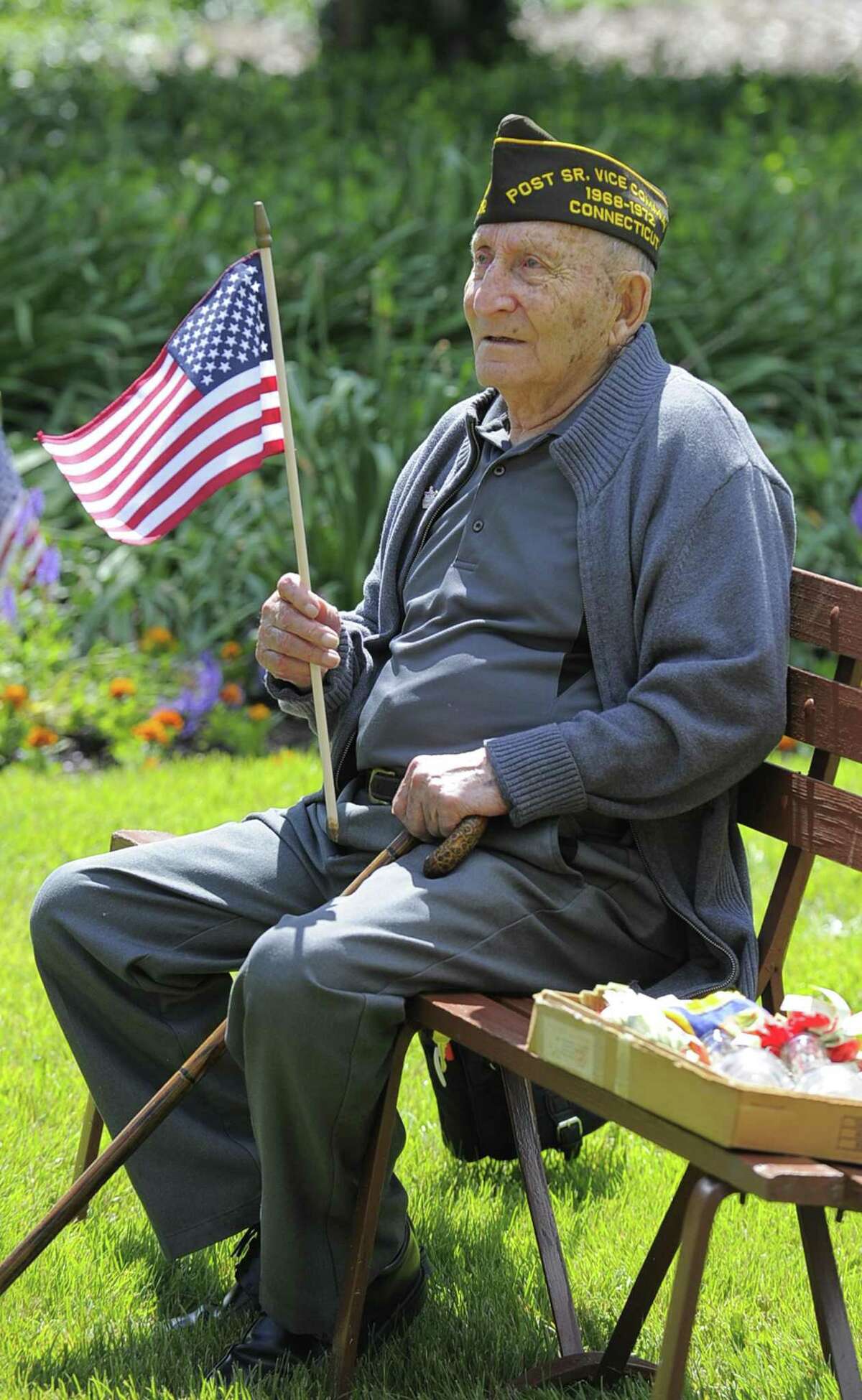 Greenwich resident Fred Intrieri, 92, who served in the Army during WWI, holds a flag during the Cos Cob VFW Post 10112 Memorial Day Ceremony to honor those who died for our country while serving in the United States Armed Services at the Cos Cob Dock VFW memorial in Greenwich, Conn. on Saturday, May 27, 2017.