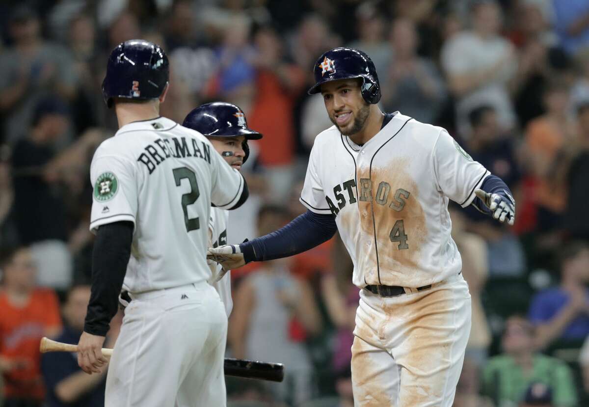 Houston Astros' George Springer celebrates his leadoff home run