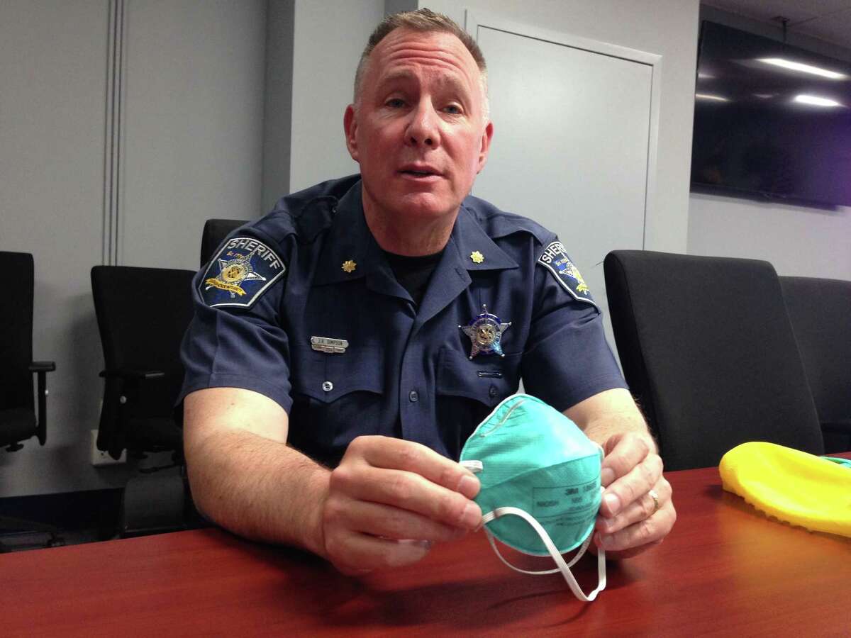 ﻿Harford County Major John R. Simpson ﻿displays elements of a protective suit that the sheriff's office is now providing to deputies sent to crime scenes involving ﻿synthetic opioids. Touching or inhaling a single particle﻿ can cause an overdose.