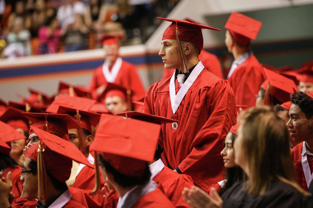 Family and staff cheer on Caney Creek HS graduates