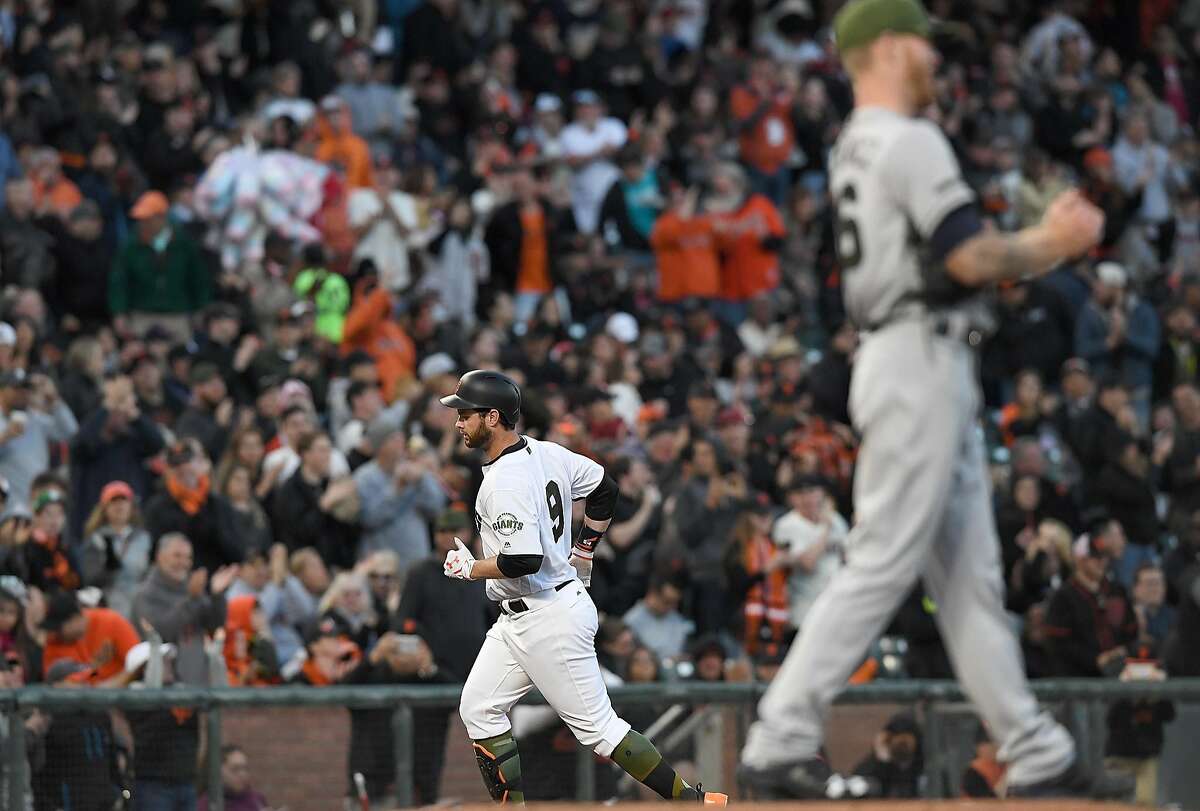 Brandon Belt of the San Francisco Giants trots around the bases after hitting a solo home run off of Mike Foltynewicz of the Atlanta Braves at AT&T Park on May 27, 2017.