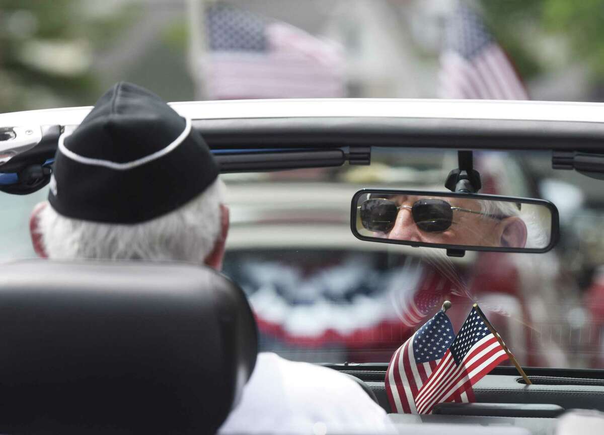 Bryam veteran Bob Merchant drives a car in the annual Byram Veterans Association Memorial Day Parade in Greenwich, Conn. Sunday, May 28, 2017. Members of the Byram Veterans marched through the streets with town leaders before a small ceremony of remembrance and honor in front of the Byram Shubert Library.