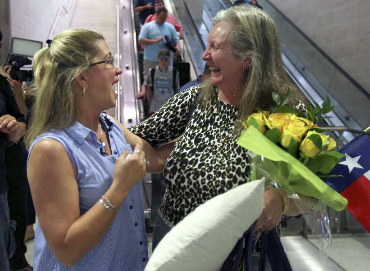 Jackie Rutter, right, of London, smiles at her San Antonio pen pal of almost 50 years, Casey Gray, as they meet Thursday, May 25, 2017 at the San Antonio International Airport for the first time.