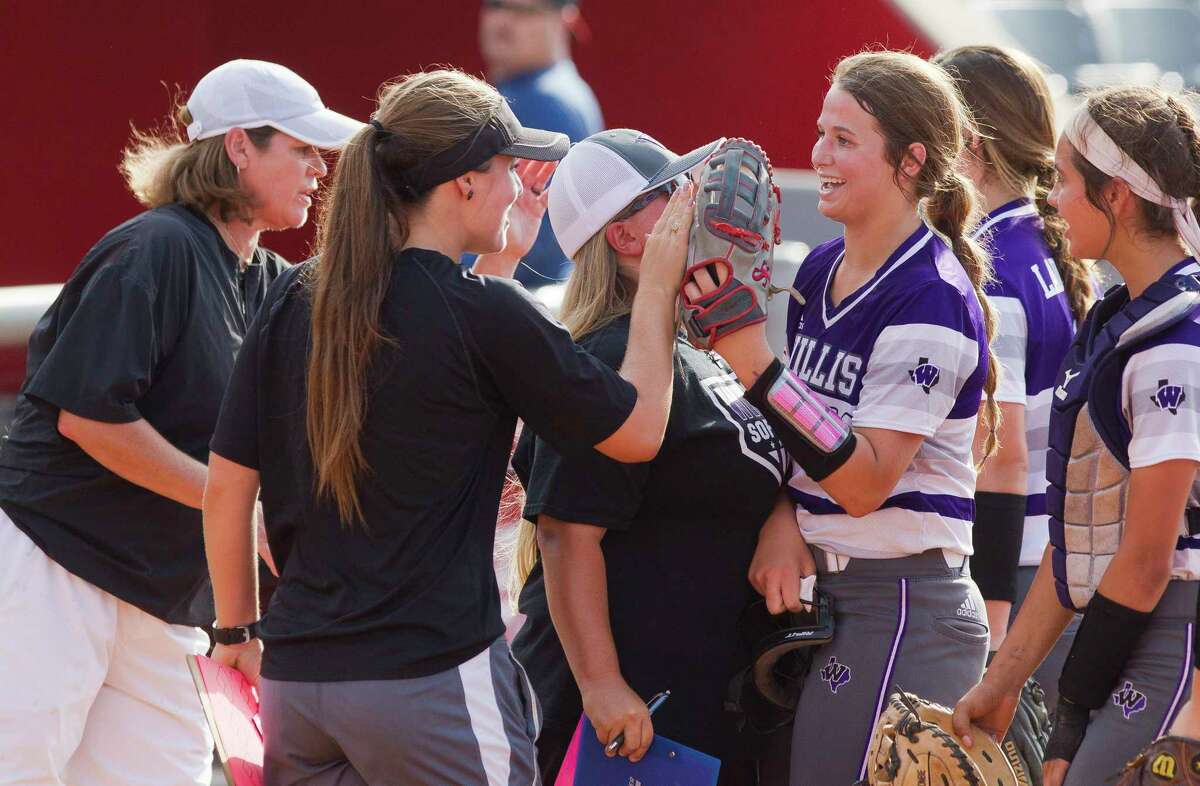 Willis starting pitcher Casey Dixon (10) gets a high-five after striking out Rebecca Miller #99 of Barbers Hill to end the third inning in Game 2 of a Region III-5A final high school softball series at Cougar Softball Stadium, Saturday, May 27, 2017, in Houston.