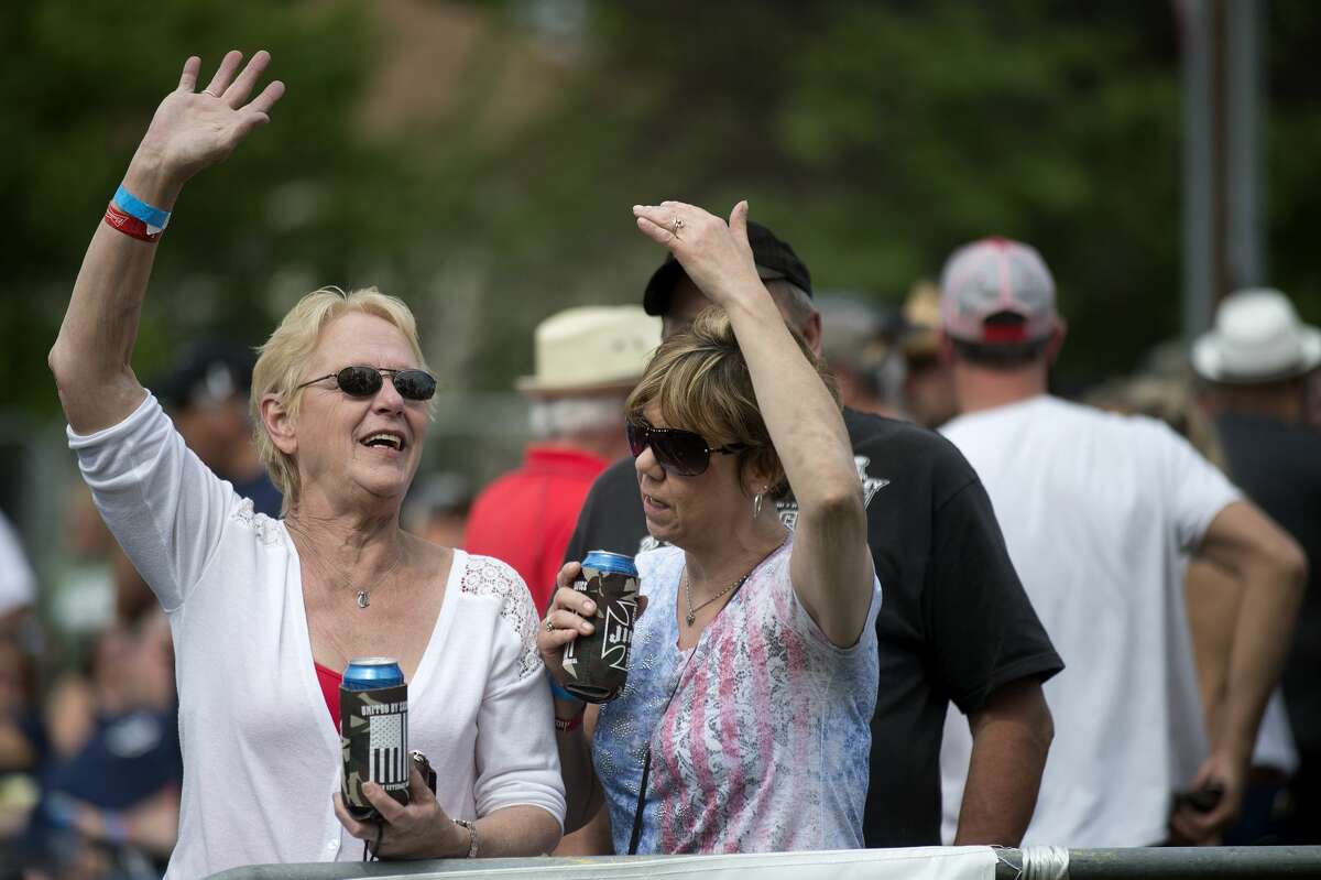 Bonnie Sanback, left, of Claire Lake and Gil Irish of St. Helen dance to The Sinclairs Band rendition of Bob Seger's "Turn the Page" during the 7th annual "United by Sacrifice" concert presented by Coleman Veterans Memorial Sunday afternoon. The Sinclairs Band, Jedi Mind Trip and The Rock Show performed all afternoon before headliner Eddie Money hit the stage.